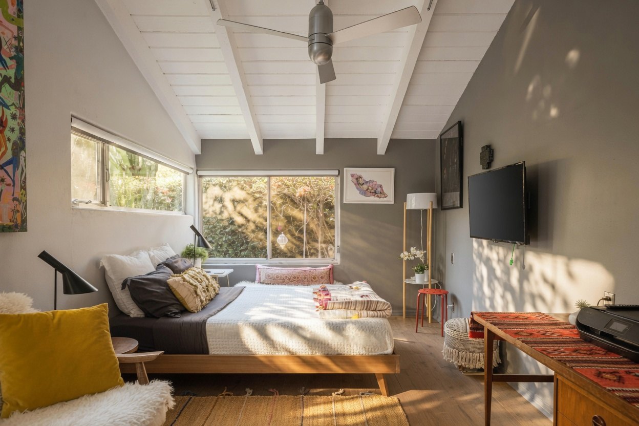 Another view of a guest bedroom with colourful furnishings