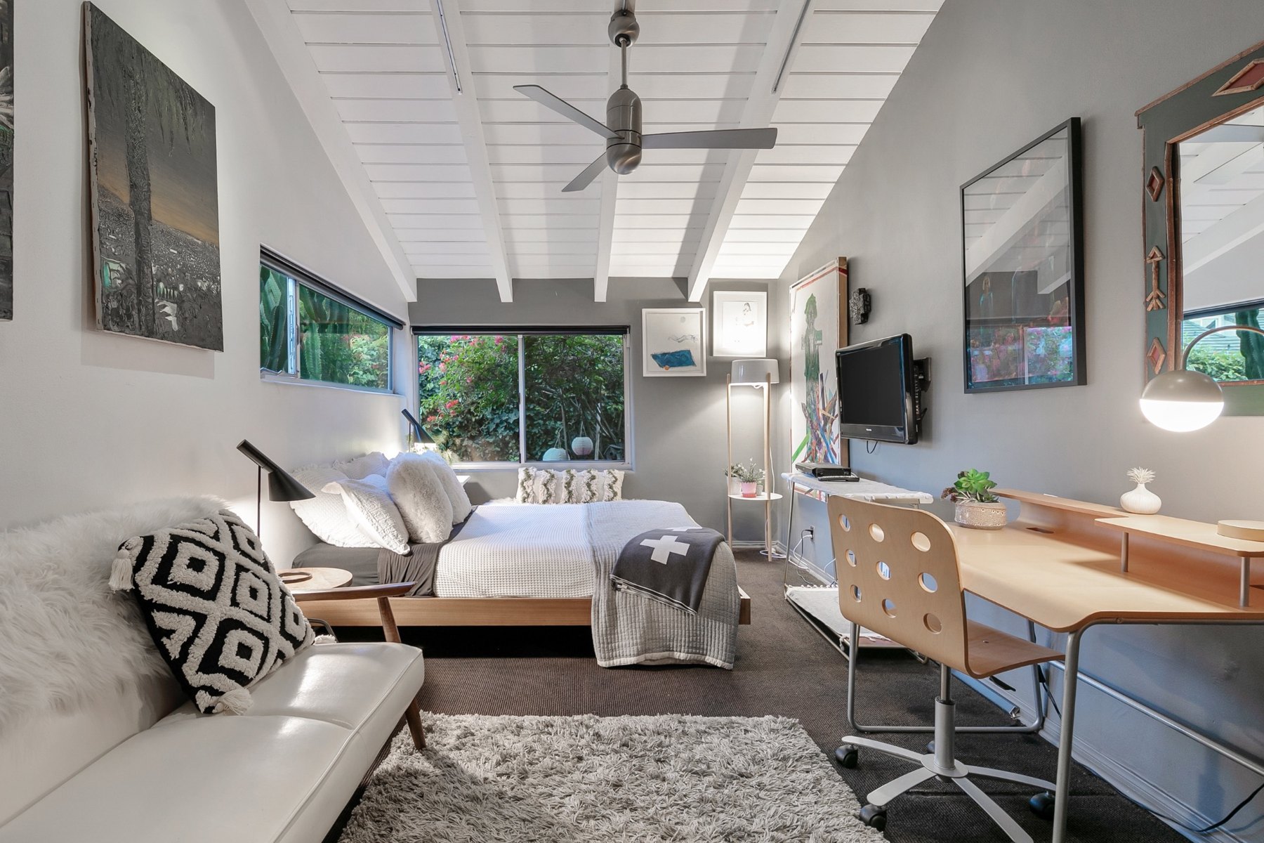 Bedroom four with a desk and garden-facing windows
