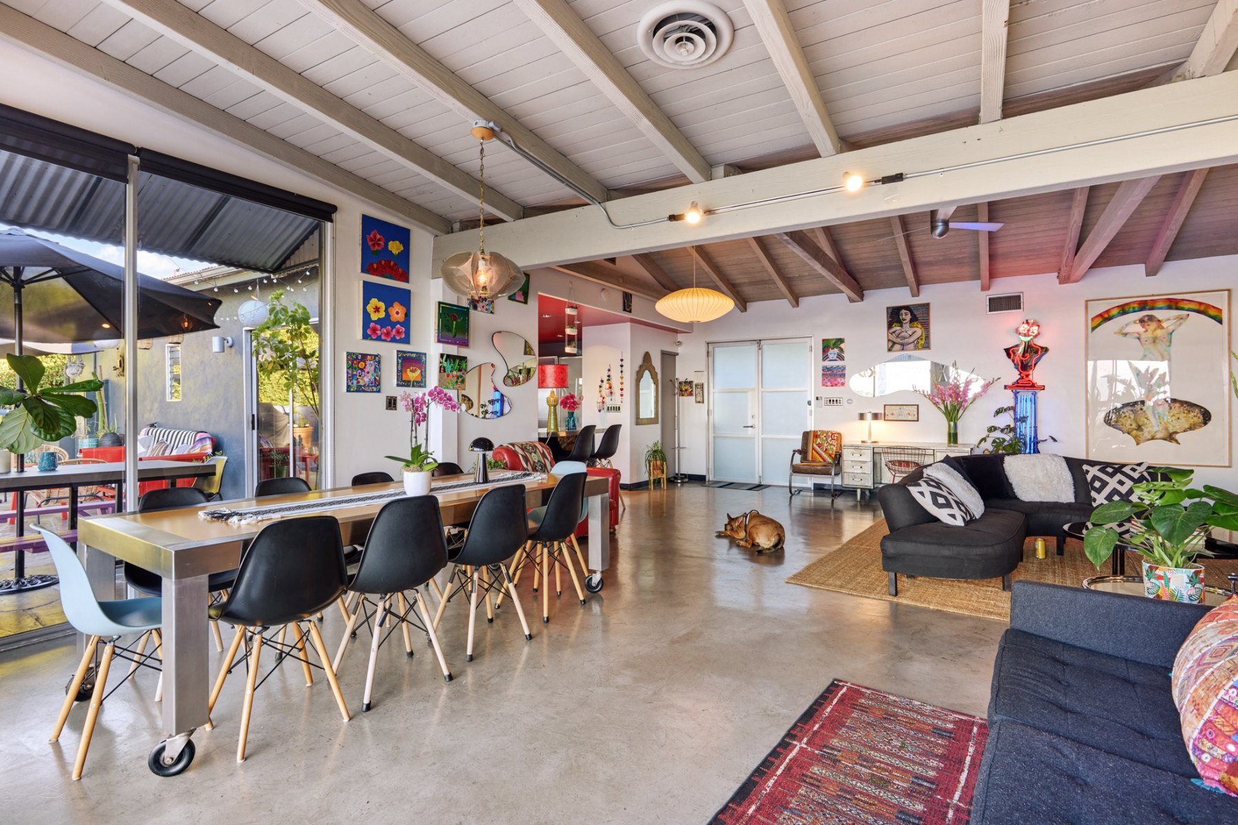 The long dining table and adjoining living space