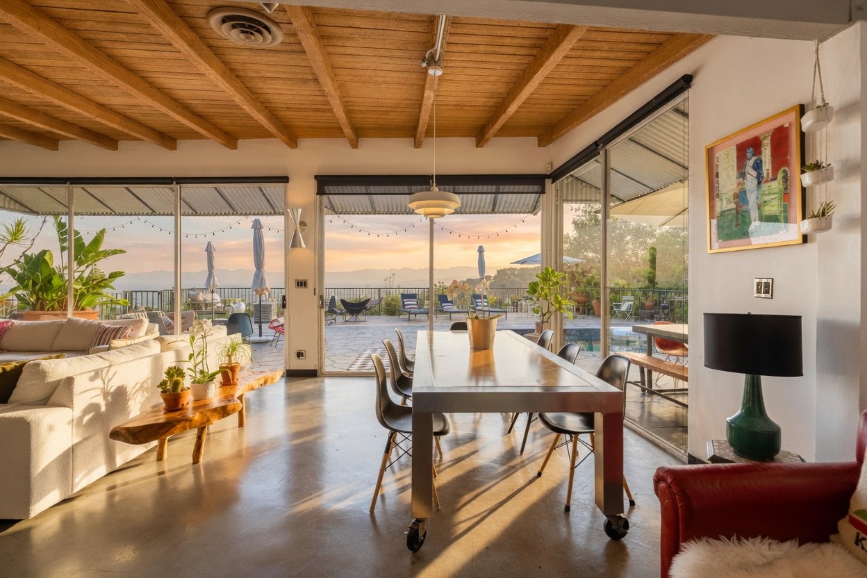 The dining table looking out toward the pool and city views