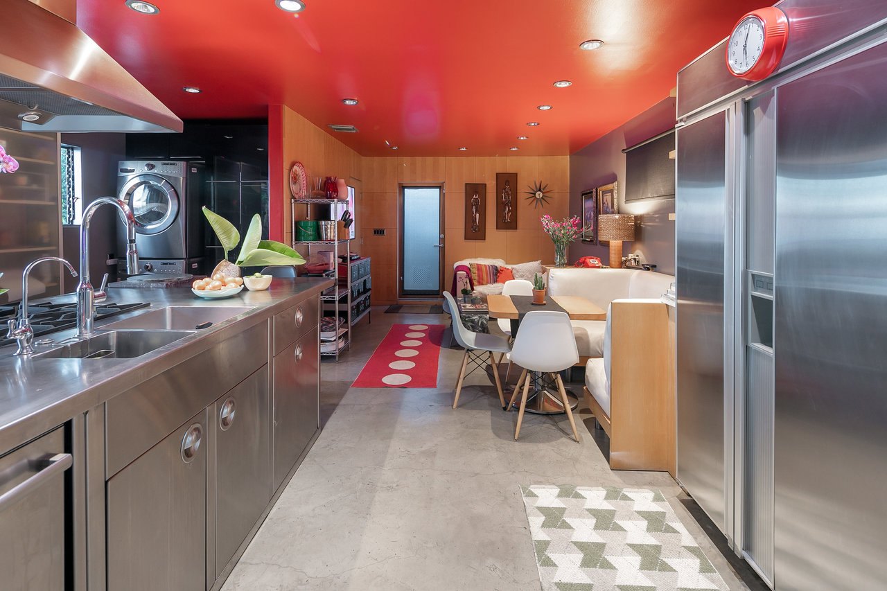 The kitchen, dining area and rear entrance
