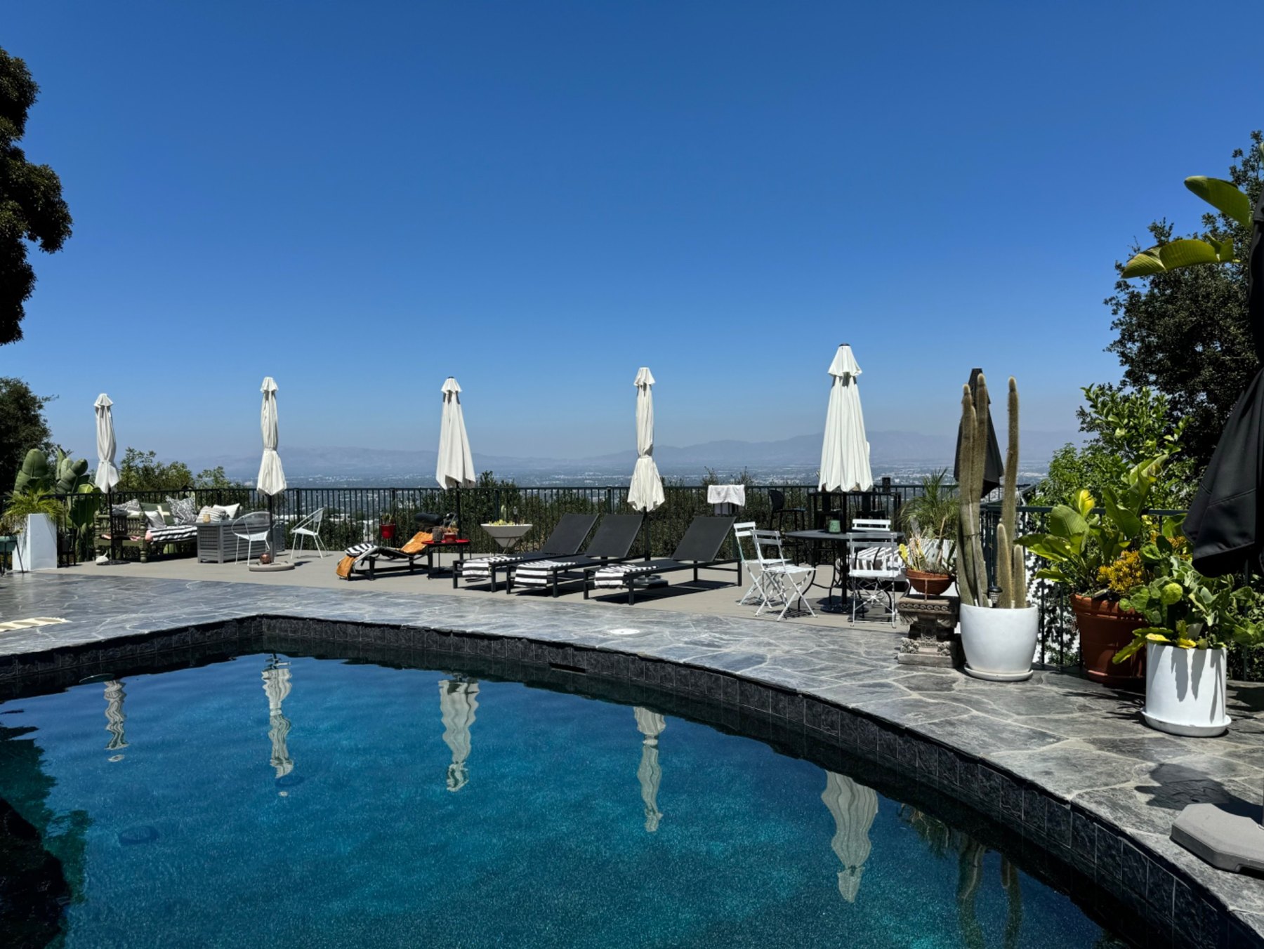 The private pool and sun loungers overlooking Los Angeles